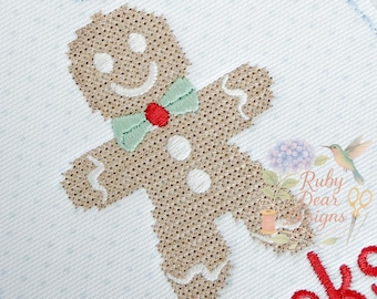 May include: Embroidered Christmas ornament with a gingerbread man design. The ornament has a red ribbon for hanging and features the name "Brooks" in red and the year "2025" in light blue.