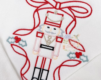 Nutcracker and Bow Frame Satin Outline Stitch Machine Embroidery Design