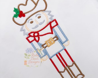 Cowboy Nussknacker Satin Konturstich Maschinenstickerei