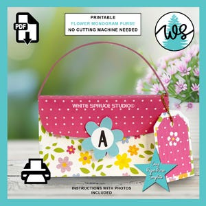May include: A printable flower monogram purse template. The purse is pink with white polka dots and a floral design. It has a blue flower with the letter "A" and a matching tag. The text reads "PRINTABLE FLOWER MONOGRAM PURSE NO CUTTING MACHINE NEEDED".