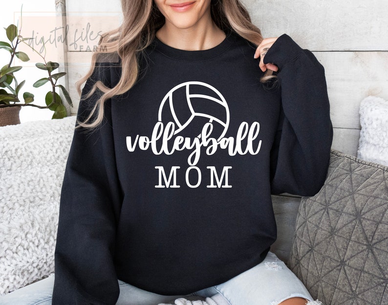 May include: Black sweatshirt with a white volleyball graphic and the text "volleyball MOM".