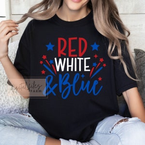 May include: A black t-shirt with the text "RED WHITE & BLUE" in red, white, and blue lettering. The text is surrounded by red and blue stars.