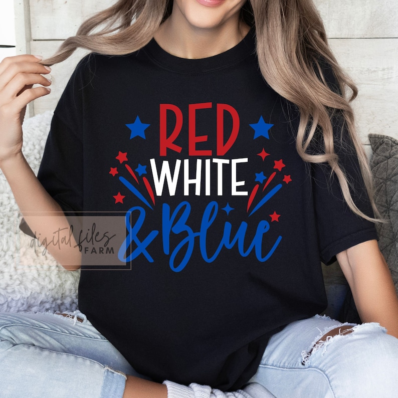 May include: A black t-shirt with the text "RED WHITE & BLUE" in red, white, and blue lettering. The text is surrounded by red and blue stars.