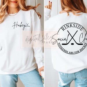 May include: White sweatshirt with the text "Hockey" on the front and a black circle with the text "Rinkside Social Club Weekends Are For Hockey" on the back.