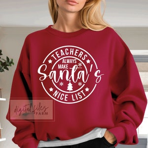 May include: Red sweatshirt with white text that reads "Teachers Always Make Santa's Nice List" in a circle.