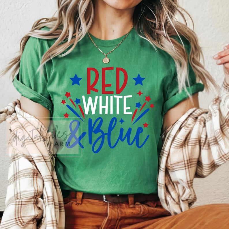 May include: Green t-shirt with the text "RED WHITE & BLUE" in red, white, and blue lettering with stars and fireworks around the text.
