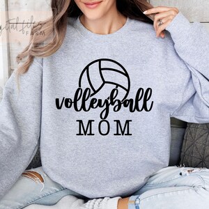 May include: Gray sweatshirt with a black volleyball graphic and the text "volleyball MOM".