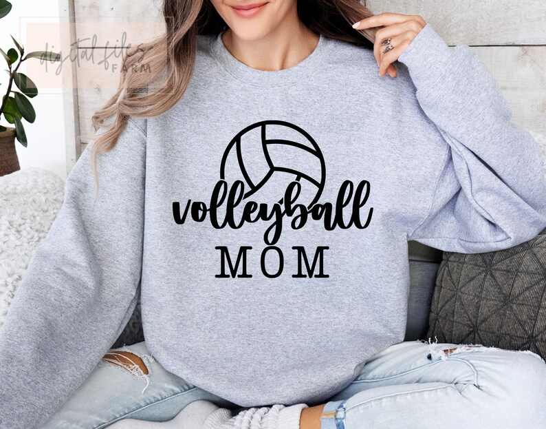 May include: Gray sweatshirt with a black volleyball graphic and the text "volleyball MOM".