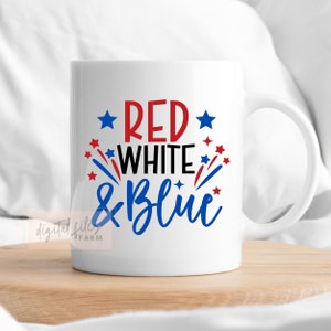 May include: White ceramic mug with a red, white, and blue design that says "Red White & Blue" with red and blue stars and firework-like shapes.