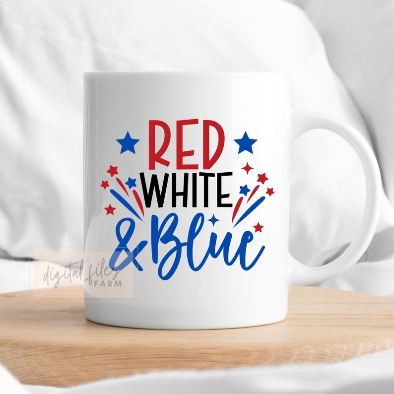 May include: White ceramic mug with a red, white, and blue design that says "Red White & Blue" with red and blue stars and firework-like shapes.