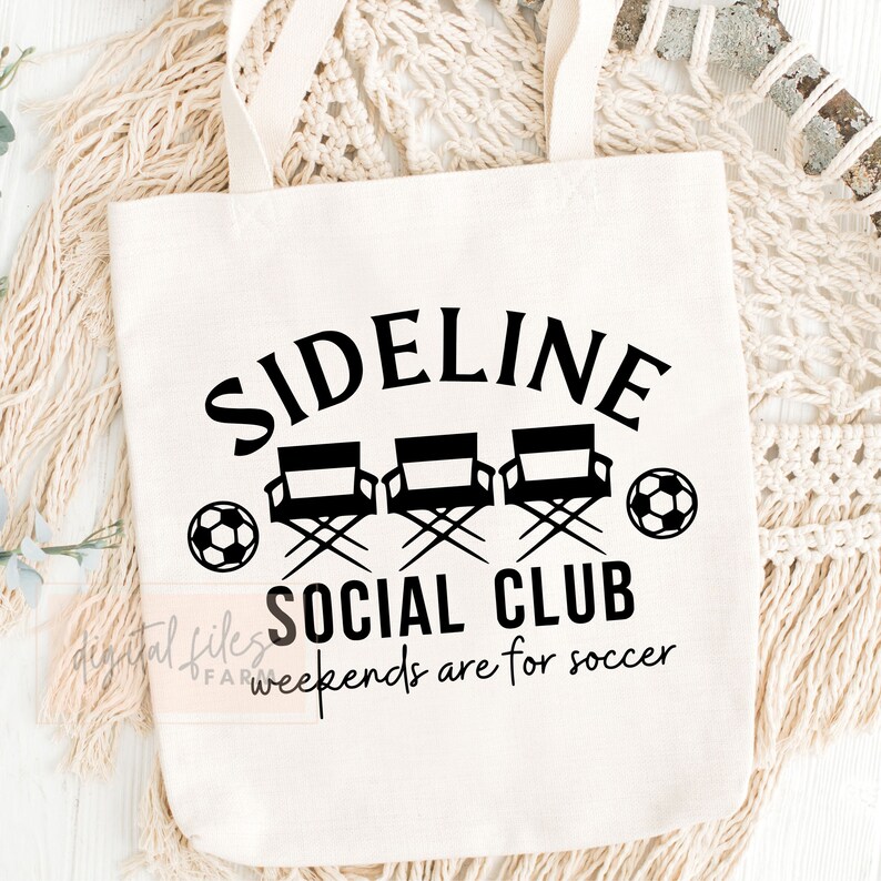 May include: White canvas tote bag with black text that reads "Sideline Social Club" and "Weekends are for soccer". The design also includes three black director's chairs and two black and white soccer balls.