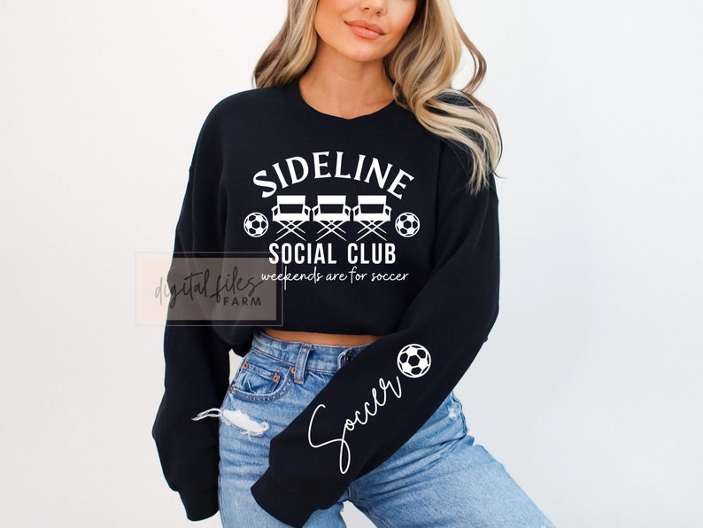 May include: Black cropped sweatshirt with white text that reads "Sideline Social Club" and "Weekends are for soccer". The sweatshirt has a soccer ball graphic on the sleeve and the word "Soccer" written in cursive.