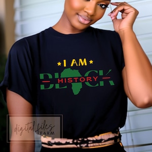 May include: A black t-shirt with a green, yellow, and red graphic design that says "I AM BLACK - HISTORY -" with a silhouette of the continent of Africa.