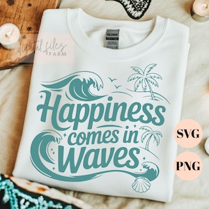 May include: White t-shirt with a teal graphic that reads "Happiness comes in Waves." The design includes stylized waves, palm trees, and a seashell. The shirt is a Gildan brand.