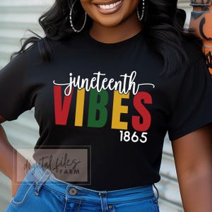 May include: Black t-shirt with the text "Juneteenth Vibes" in red, yellow, green, and blue letters. The year "1865" is printed in white below the text.
