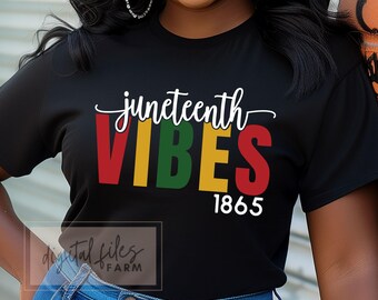 May include: Black t-shirt with the text "Juneteenth Vibes" in red, yellow, green, and blue letters. The year "1865" is printed in white below the text.