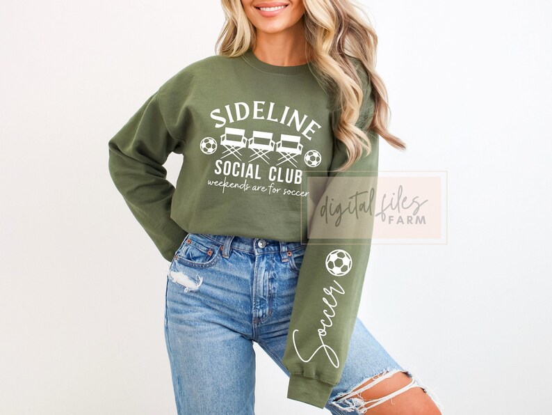 May include: A green sweatshirt with the text "Sideline Social Club" and "Weekends are for soccer" in white. The sweatshirt has a graphic of three director's chairs and a soccer ball. The right sleeve has the word "Soccer" written vertically in white.