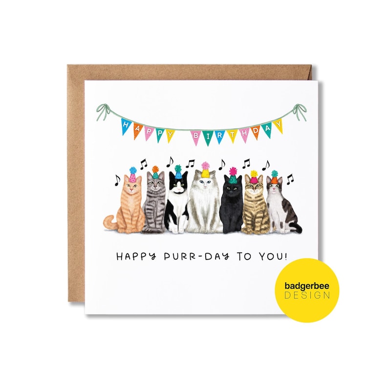 K&ouml;nnte beinhalten: Eine wei&szlig;e Karte mit einem bunten Banner, auf dem "Happy Birthday" steht, und einer Reihe von sieben Katzen, die Partyh&uuml;te tragen. Der Text unter den Katzen lautet "Happy Purr-Day To You!" und in der rechten unteren Ecke befindet sich ein gelber Kreis mit dem Text "badgerbee DESIGN".
