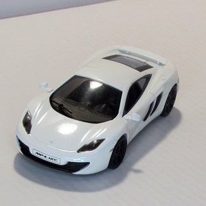 McLaren MP4-12C (white), Solido Box. Vintage collectible supercar. scale diecast model 1:43. british sportcar car replica. road car models