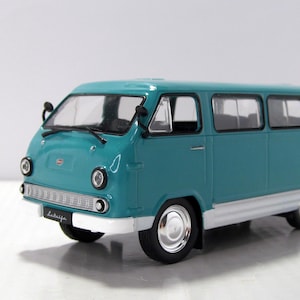 May include: A rustic wooden sign with the text "Welcome to our home" in white lettering. The sign has a distressed finish and a simple, inviting design, suitable for a front porch or entryway.