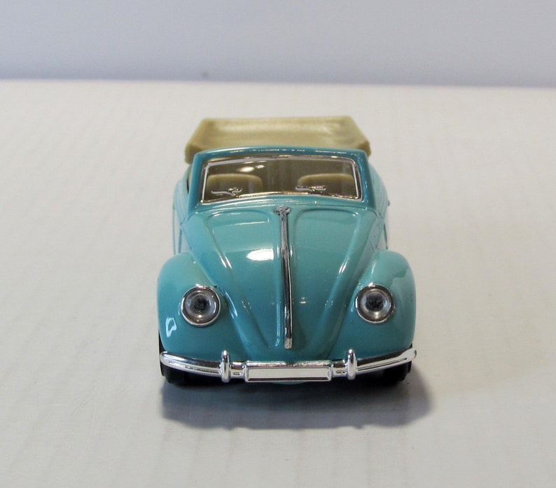 VW Coccinelle cabriolet ouvert vert foncé métallisé (1964) - SNC