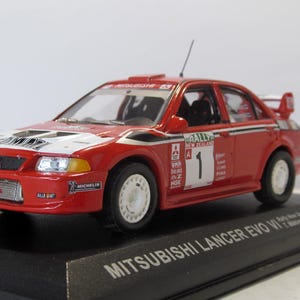 Mitsubishi Lancer Evo VI Rally New Zealand 1999, Altaya, box. Collectible car. scale diecast model 1:43. car replica. birthday gift.