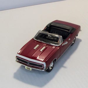 Chevrolet Camaro 1967, Ertl USA. Vintage collectible car. scale diecast model 1:43. Replica American sports car. Convertible coupe.