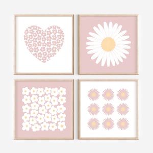 May include: Set of four pink and white floral prints with a heart, a daisy, a pattern of small flowers, and a pattern of larger flowers.