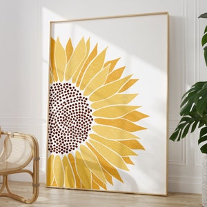 Puede incluir: Una gran impresi&oacute;n abstracta de girasol en tonos amarillos y marrones. El girasol est&aacute; estilizado y llena el lienzo, con un fondo blanco.