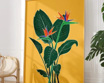 May include: A vertical rectangular wall art print featuring a vibrant mustard yellow background with a central illustration of two bird of paradise flowers. The plant has large, dark green leaves with visible white outlines and orange and blue petals.