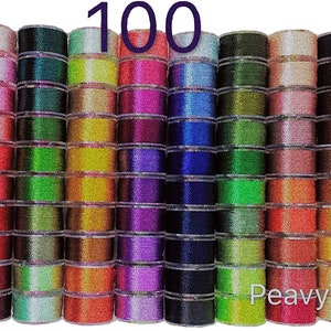 May include: A collection of 100 spools of thread in various colors, including red, blue, green, yellow, and purple. The spools are arranged in rows and are all the same size. The text "100" is printed in large letters at the top of the image. The text "Peavy Tailor" is printed in the bottom right corner of the image.