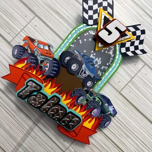 May include: A colorful birthday card featuring three monster trucks racing on a track. The card includes the name "Talen" in a textured font, flames, checkered flags, and the number "5".