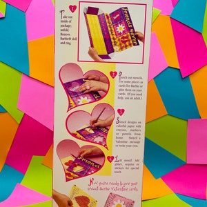 May include: A pink and white box with a Barbie doll on the front. The box contains a craft kit for making Valentine's Day cards. The box includes stencils, stickers, and instructions. The text on the box reads "Barbie Friends 4ever".