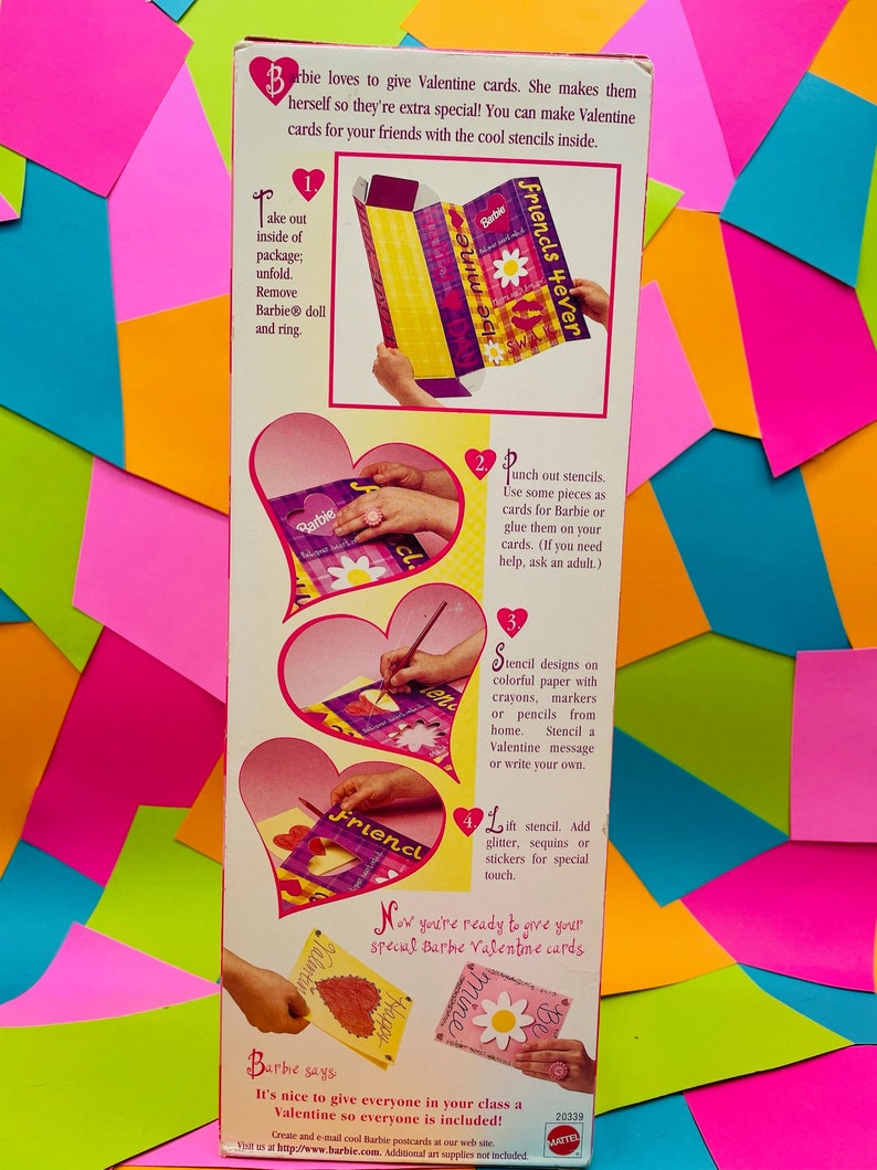 May include: A pink and white box with a Barbie doll on the front. The box contains a craft kit for making Valentine's Day cards. The box includes stencils, stickers, and instructions. The text on the box reads "Barbie Friends 4ever".