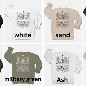 May include: A variety of colors of sweatshirts with a white graphic of a sword in a tree on the back. The colors are black, white, sand, navy, forest, military green, ash, and gray.