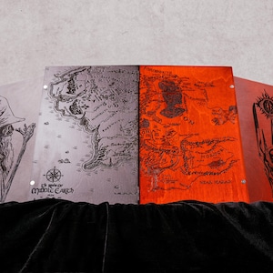May include: A four-panel folding screen featuring laser-engraved illustrations. The left panel shows a wizard, the second displays a map of Middle-earth, the third depicts a map of Mordor, and the right panel features a dark tower with an eye.