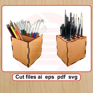 May include: Two wooden desk tidies, one filled with coloured pencils and markers, the other with paintbrushes and pens. The tidies are made of light brown wood with a slotted design. The text "Cut files ai eps pdf svg" is at the bottom.