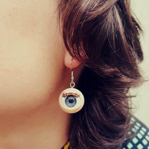 Blinking eye doll earrings