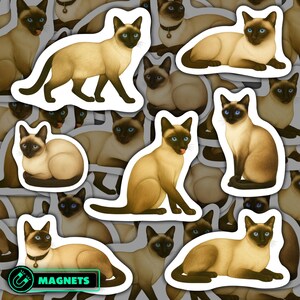 May include: A collection of stickers featuring Siamese cats in various poses. The cats have tan bodies, dark brown faces, ears, paws, and tails, and striking blue eyes. The word "MAGNETS" is visible on one sticker.