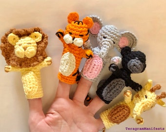 May include: Set of five finger puppets featuring different animals: a lion, tiger, elephant, monkey, and giraffe. The puppets are crocheted in various colors, including yellow, orange, brown, gray, and black.
