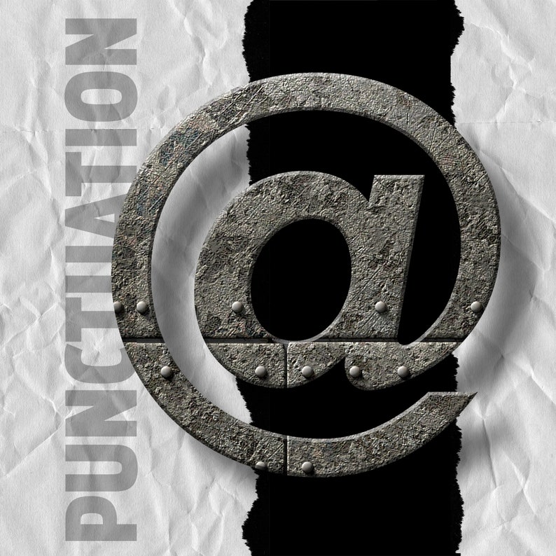 May include: A close-up of a metal "at" symbol, with a rough, textured surface, as if it were made of iron. The symbol is partially obscured by a torn piece of paper with the word "PUNCTUATION" printed on it.
