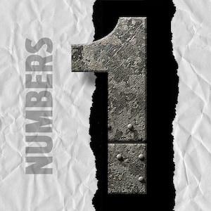 May include: The number one is made of metal with a rough, textured surface. The number is ripped through a piece of white paper with the word "NUMBERS" printed on it.