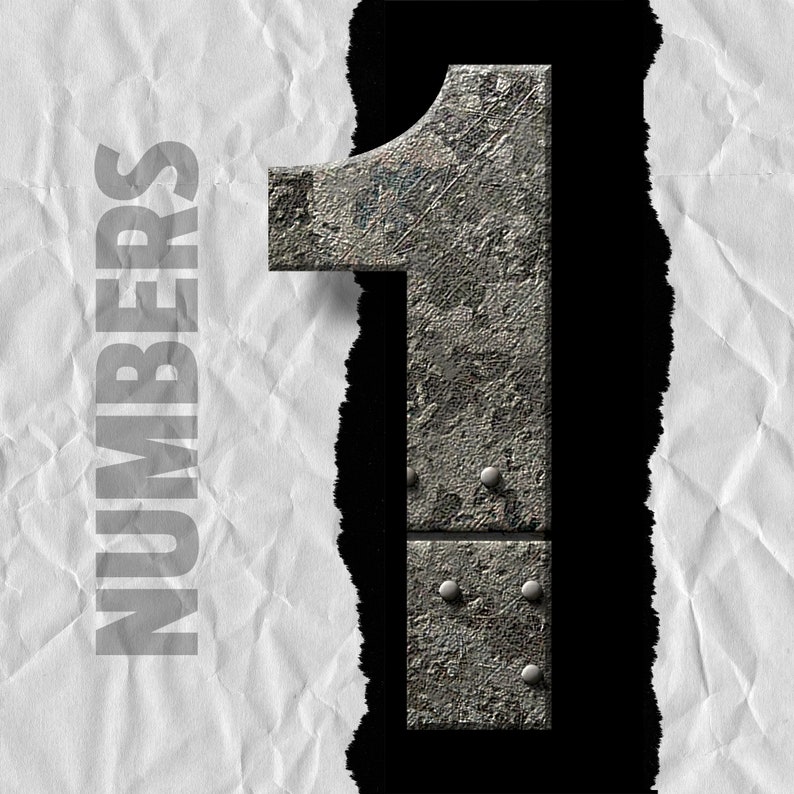 May include: The number one is made of metal with a rough, textured surface. The number is ripped through a piece of white paper with the word "NUMBERS" printed on it.