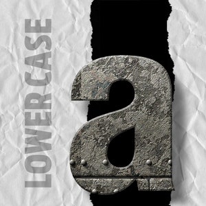 May include: A lowercase letter "a" made of metal with a rough, textured surface. The letter is in a distressed, industrial style with rivets and a worn appearance.