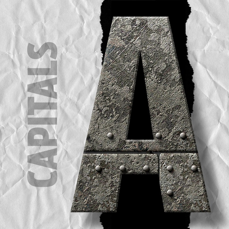 May include: A large, metal letter A with a rough, textured surface. The letter is made of gray metal and has a black background. The letter is slightly tilted to the right.