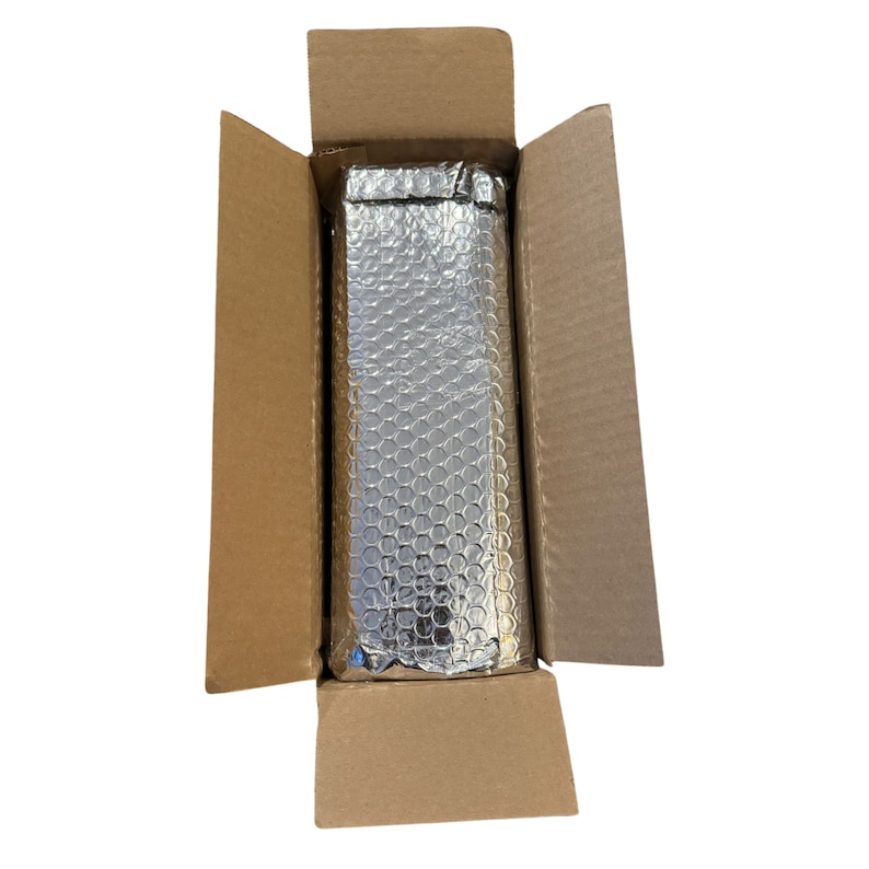 May include: A brown cardboard box with the top flaps open, revealing a silver bubble wrap insulation inside.