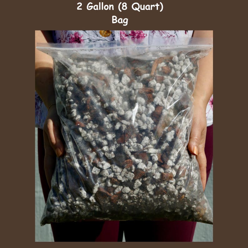May include: A clear plastic bag filled with a mixture of small, white, brown, and black rocks. The bag is labeled "2 Gallon (8 Quart) Bag".