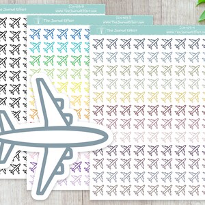 May include: Airplane-themed sticker sheets in various colors, including black, blue, green, yellow, and purple. The stickers feature a simple airplane design. The Journal Effect is printed on the top of the sticker sheets.