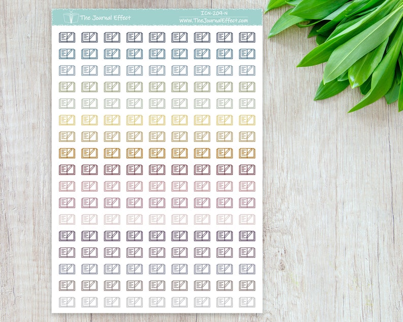 May include: A sheet of stickers with a repeating pattern of open books with a pencil icon. The stickers are in various shades of blue, yellow, brown, and pink.