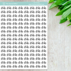May include: A sheet of 100 black and white bicycle stickers. The stickers are arranged in a grid pattern. The text "The Journal Effect" and "www.TheJournalEffect.com" is printed at the top of the sheet.
